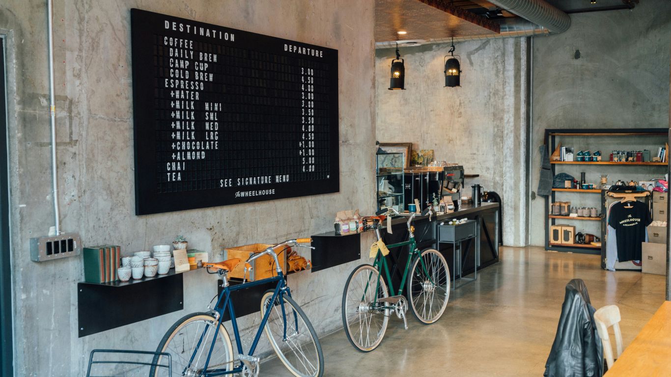Modern coffee shop counter with steaming cups
