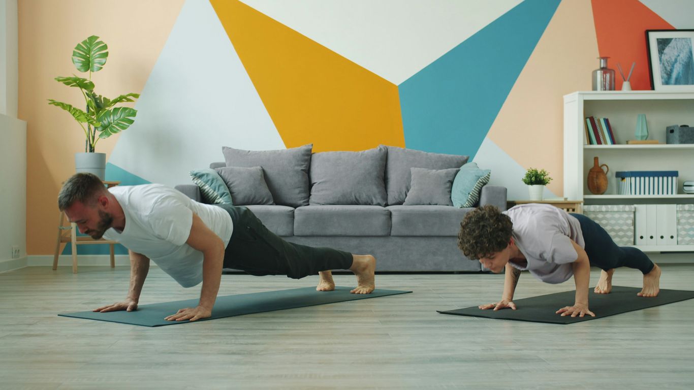 Family practicing yoga in the living room