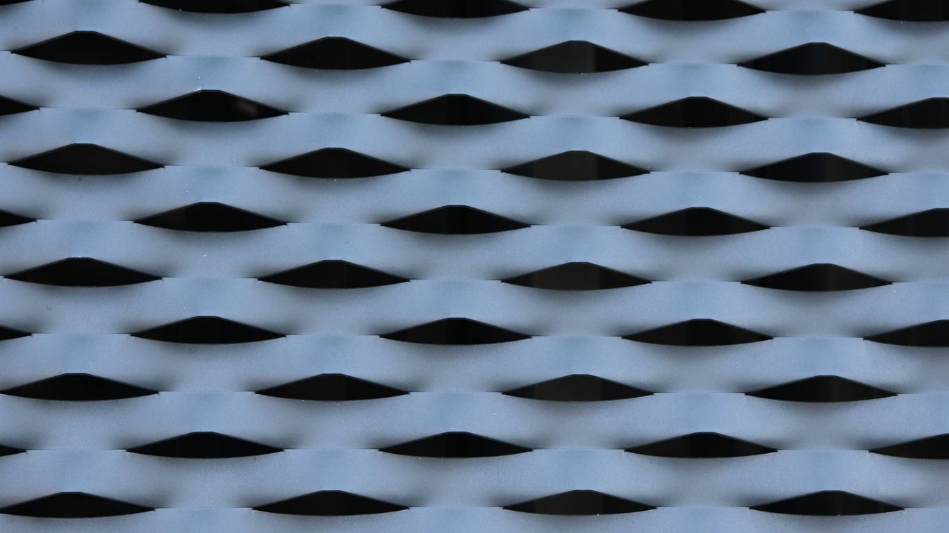 a close up of a cell phone with a pattern on it