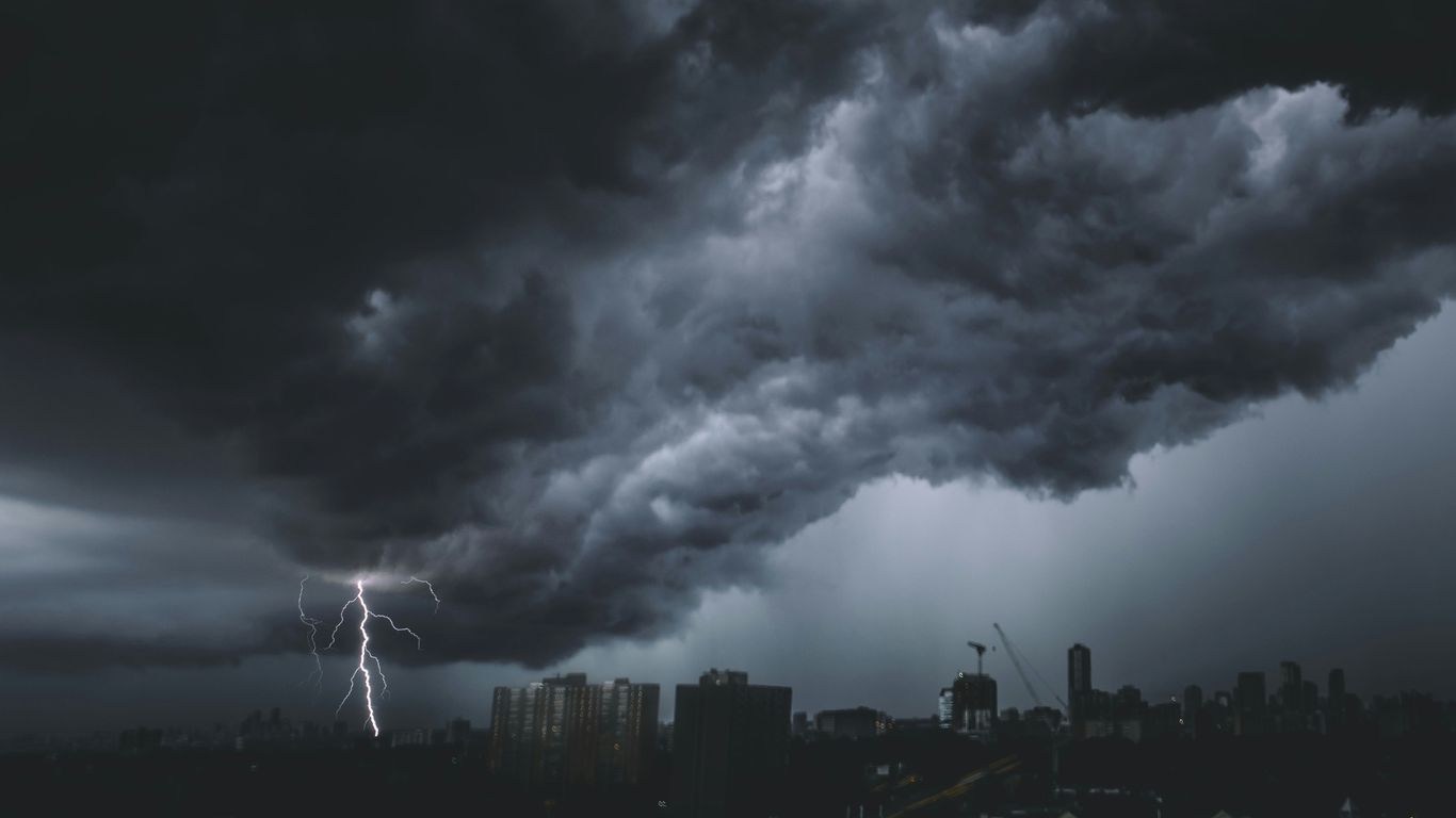 a storm is coming in over a city