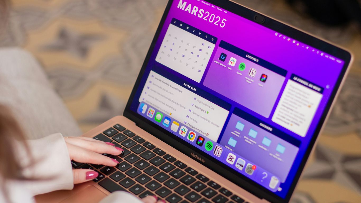 A woman using a laptop computer on her lap