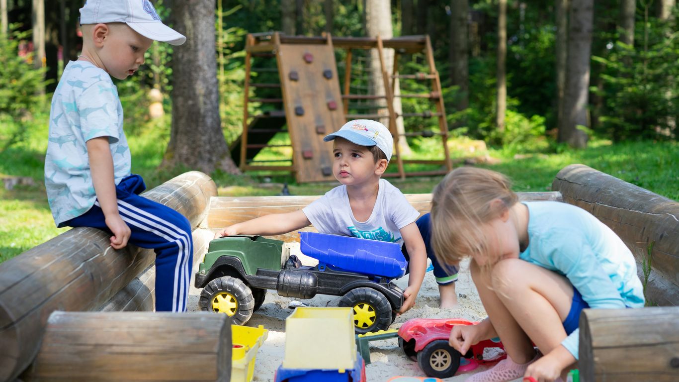 Preschoolers running and balancing outdoors