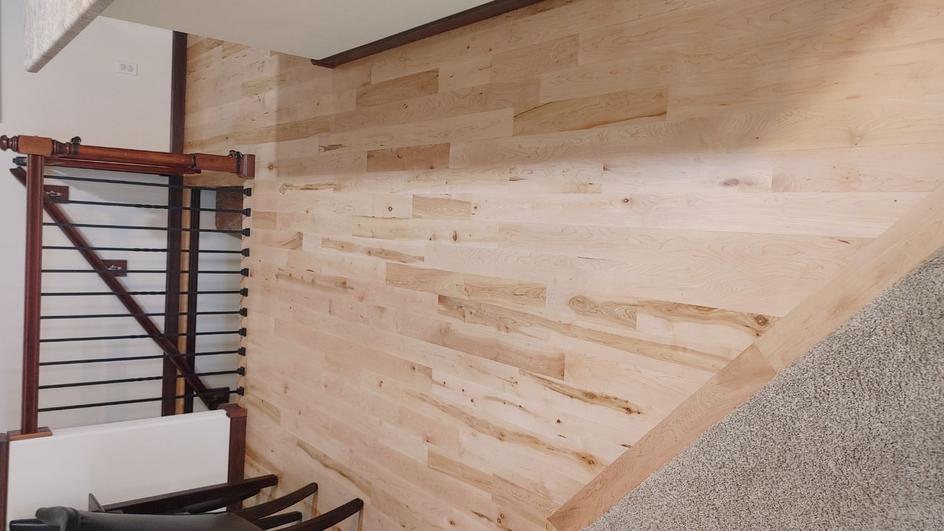 Light wooden floor in a spacious interior setting.