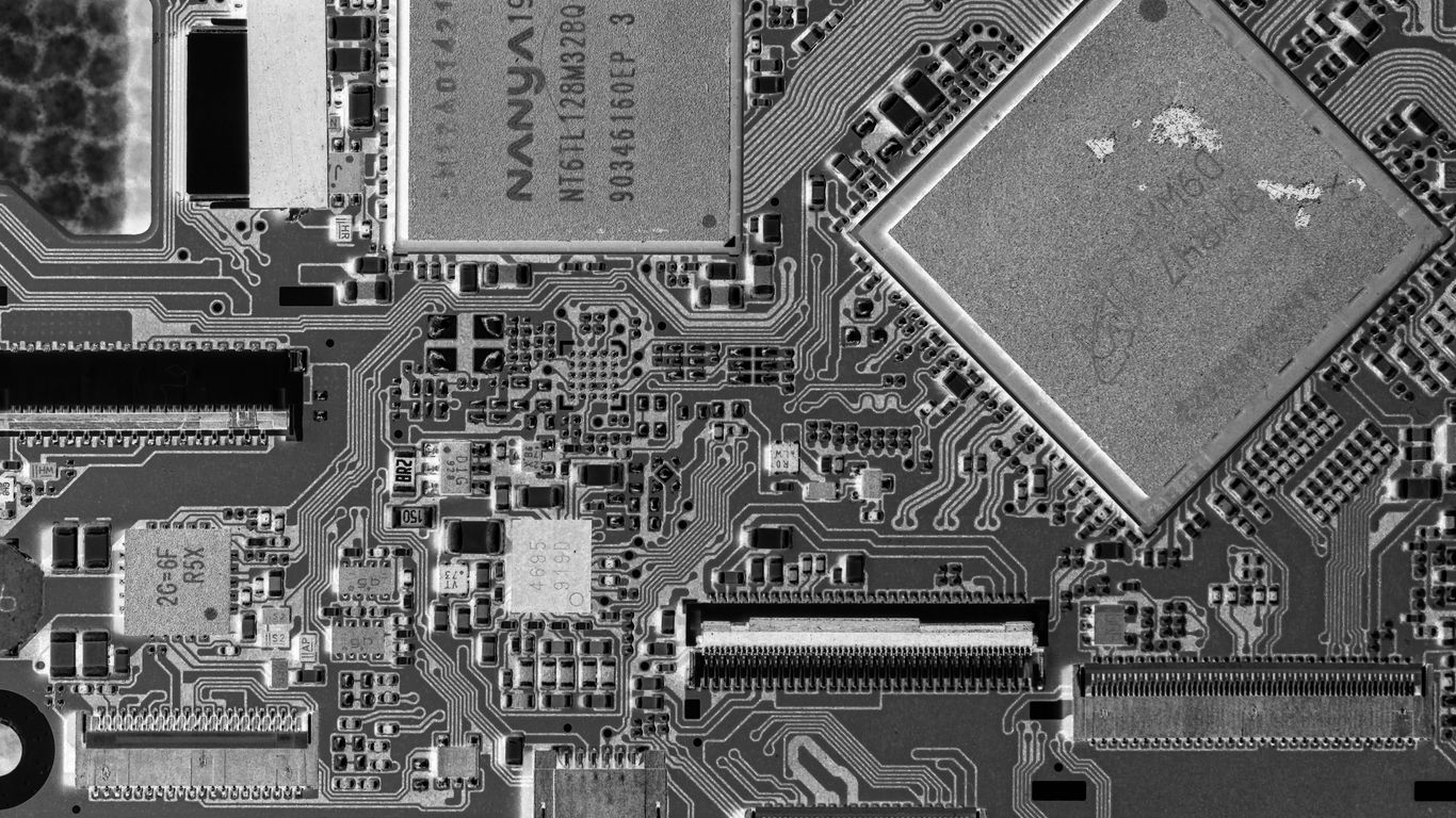 Close-up of a complex electronic circuit board with many components.