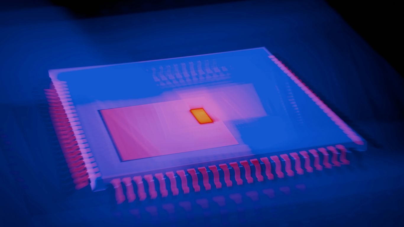 A close up of a computer chip in a dark room