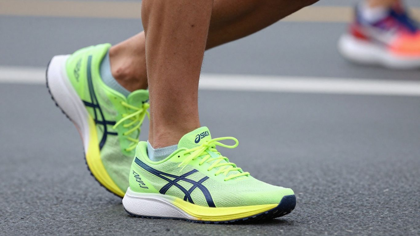 Asics Metaspeed Sky Paris running shoes in action.