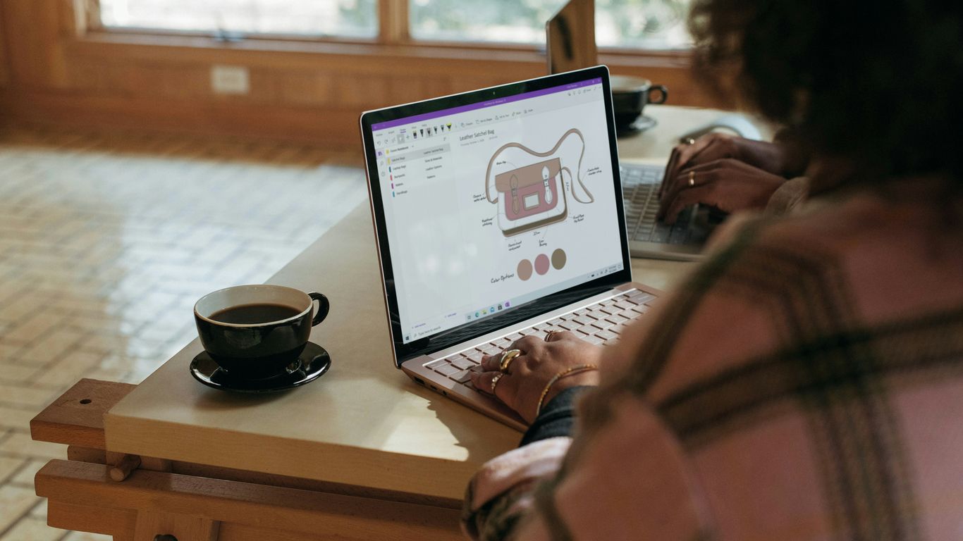 person using Surface device on table