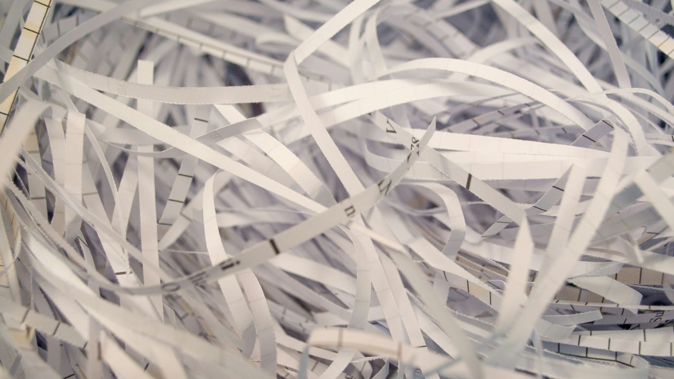 a pile of white shredded paper sitting on top of a table