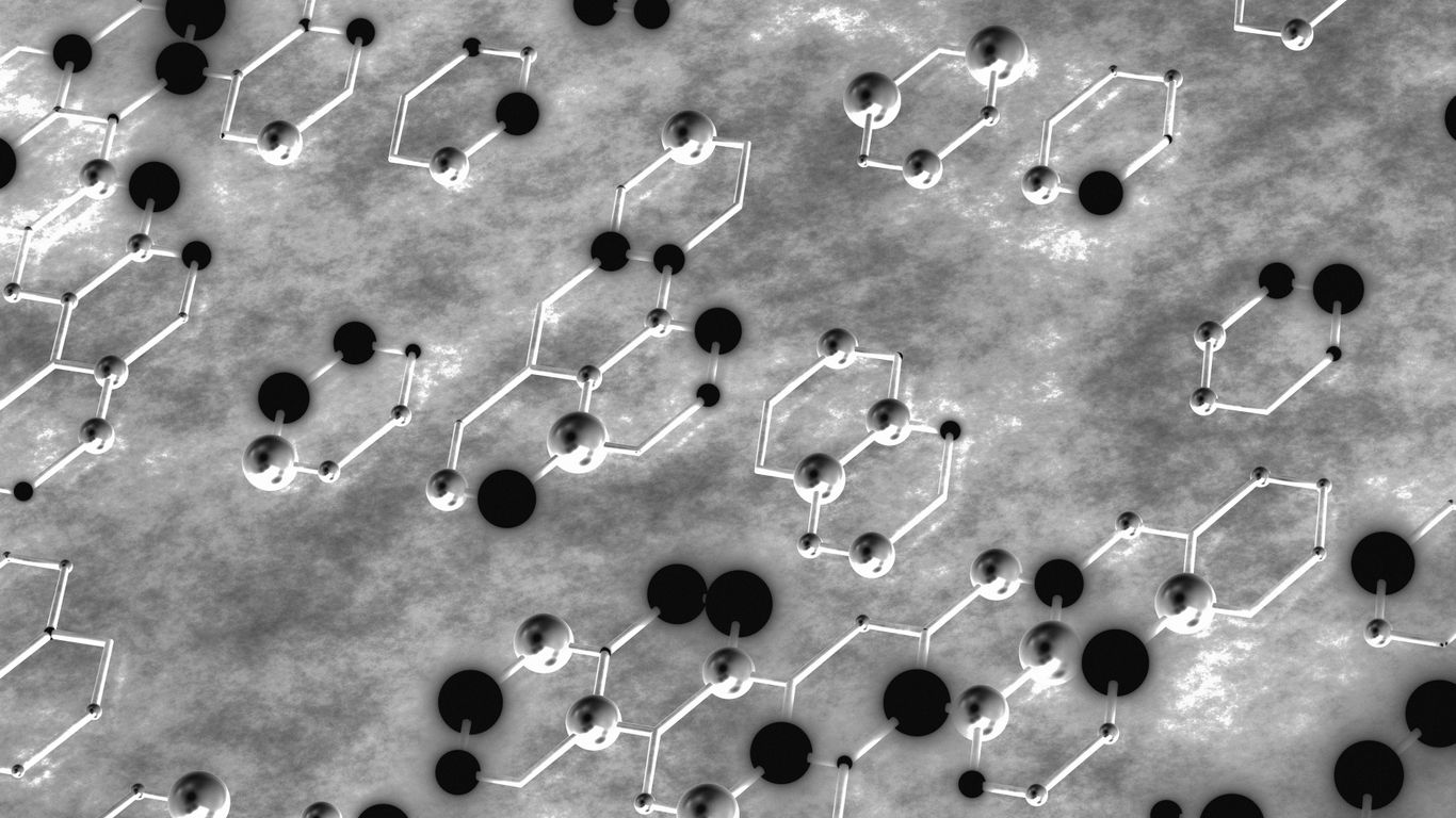 Abstract molecular structure with hexagonal rings and spheres.