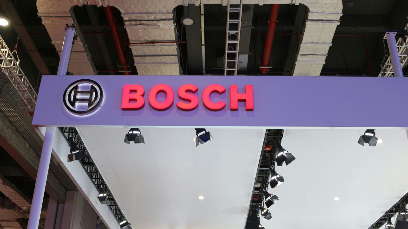 a purple sign that says bosch hanging from the ceiling