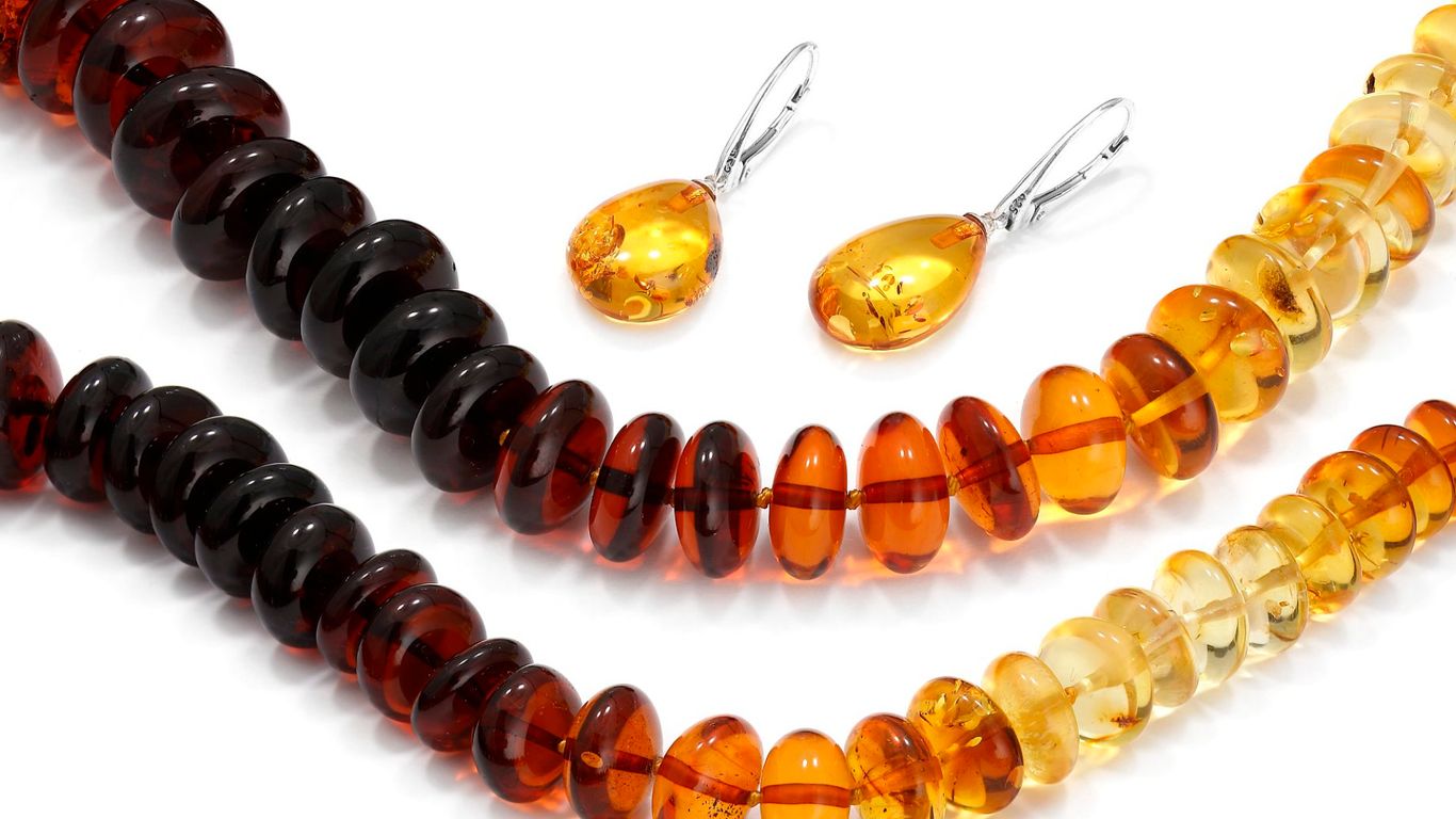 Amber necklaces and earrings in various shades of brown and yellow.