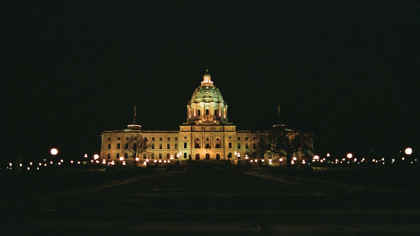 a large building lit up at night time