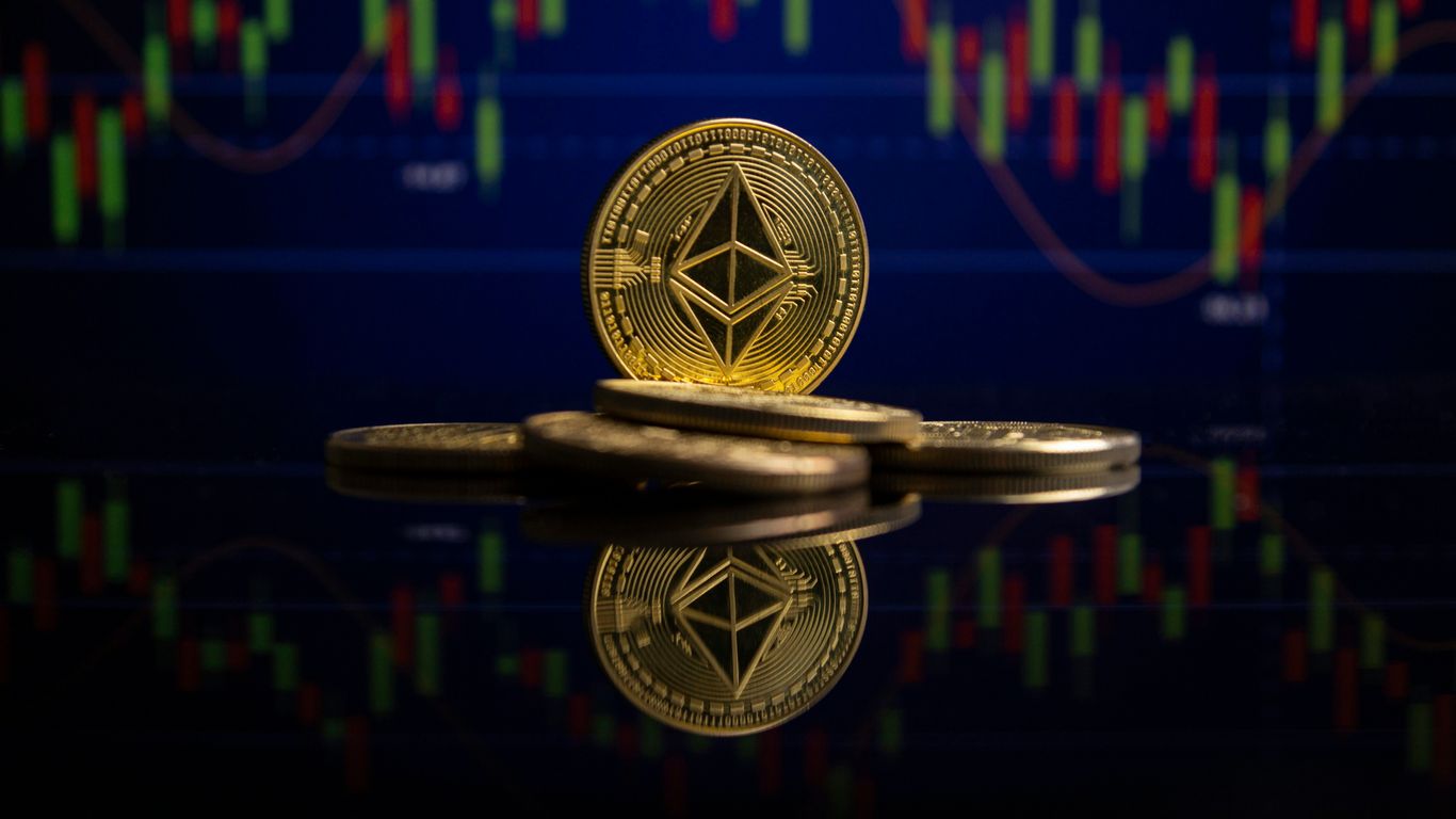 Five gold coins with Ethereum symbol against financial chart background.