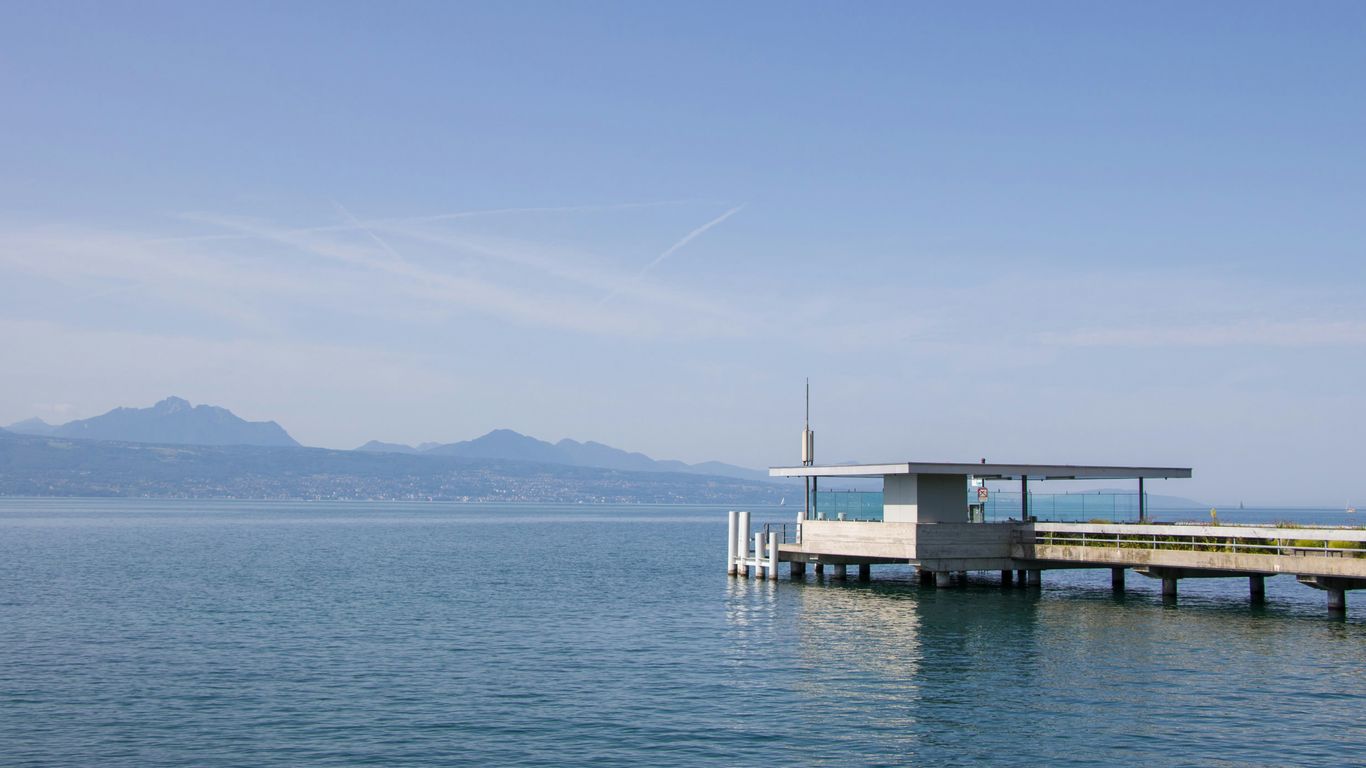 A pier on the water with a sky background