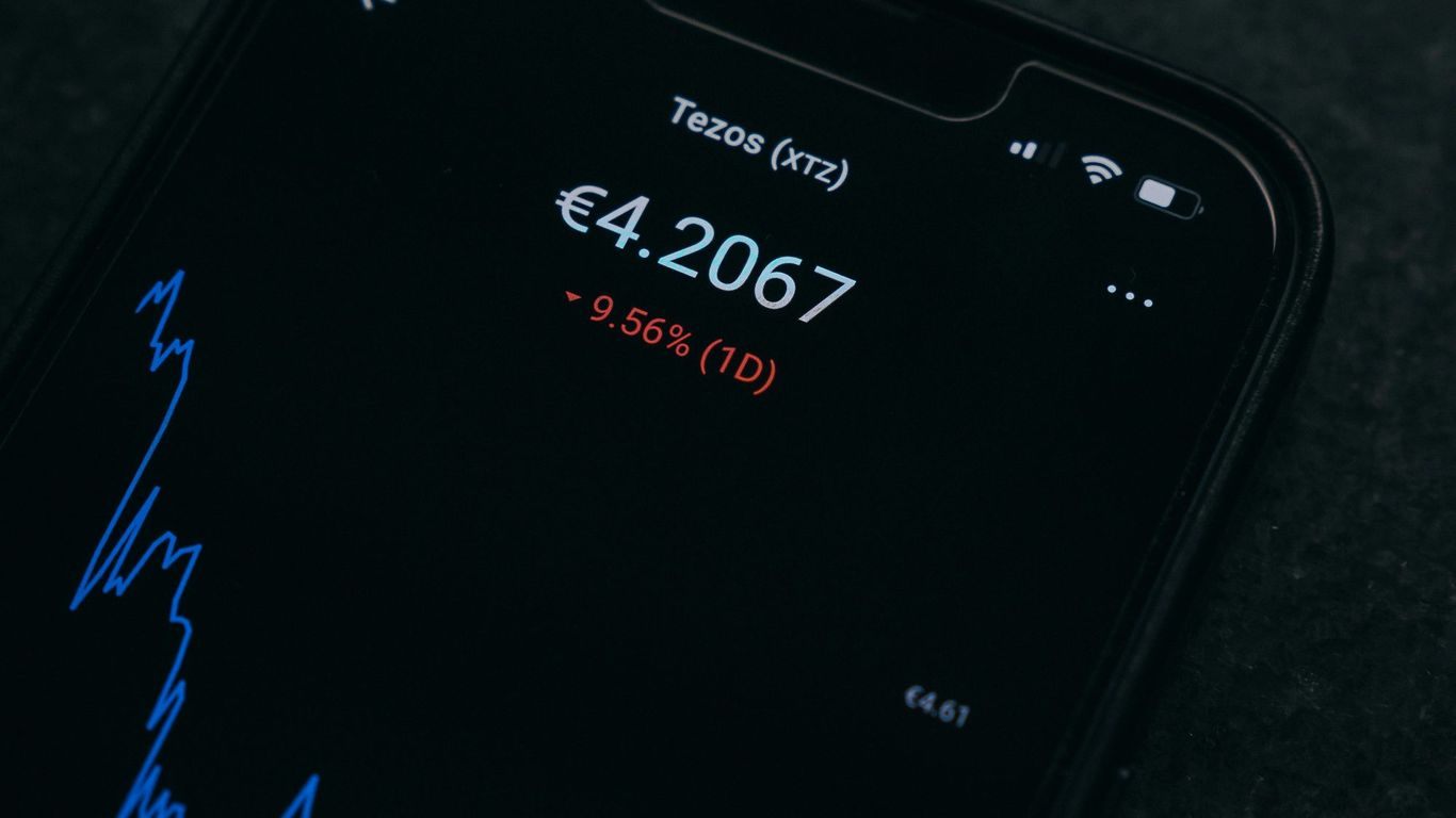 Digital screen displaying cryptocurrency values and market trends.