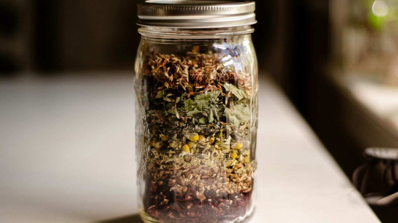 a glass jar filled with different types of food