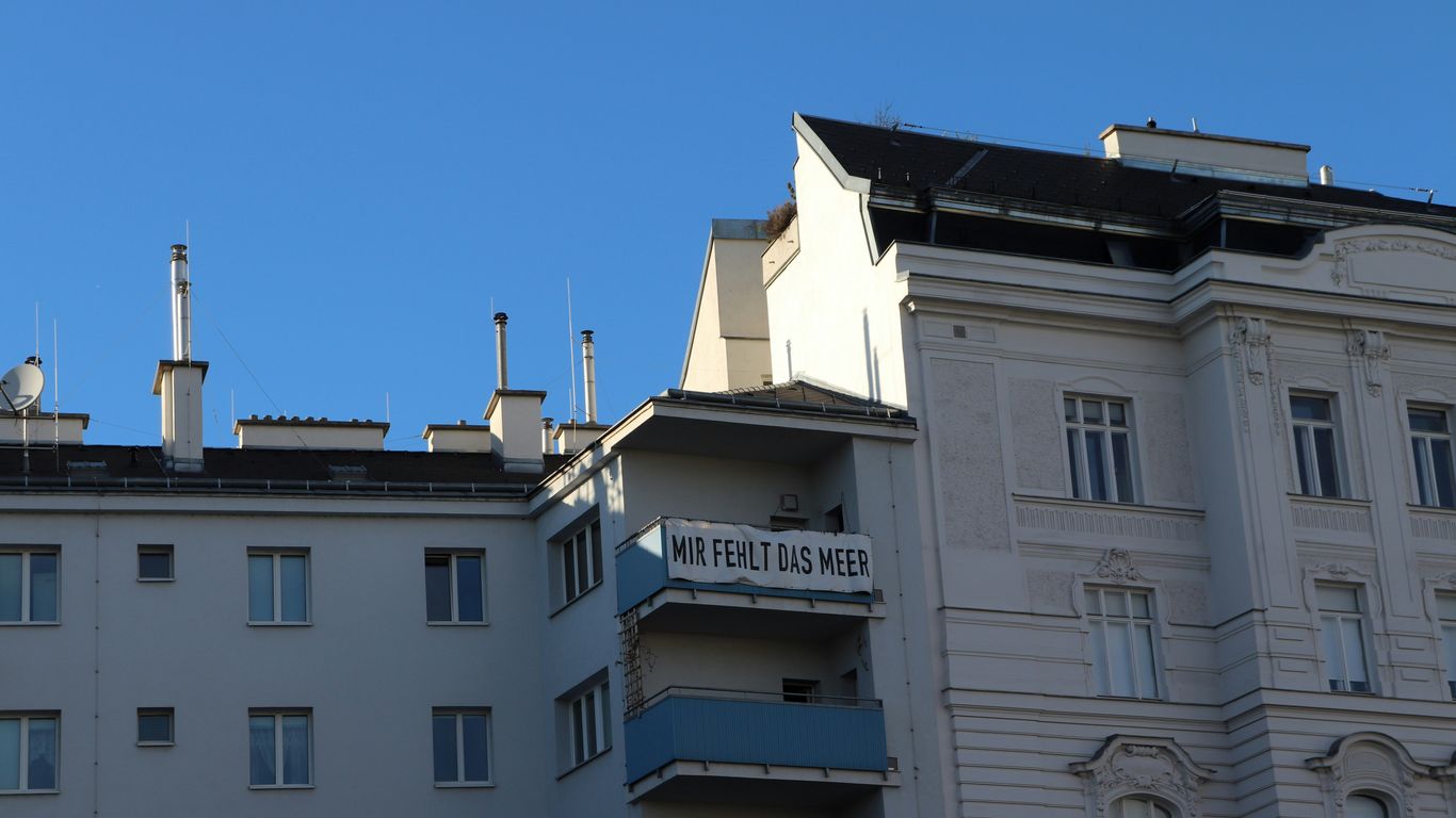 a white building with a sign on top of it