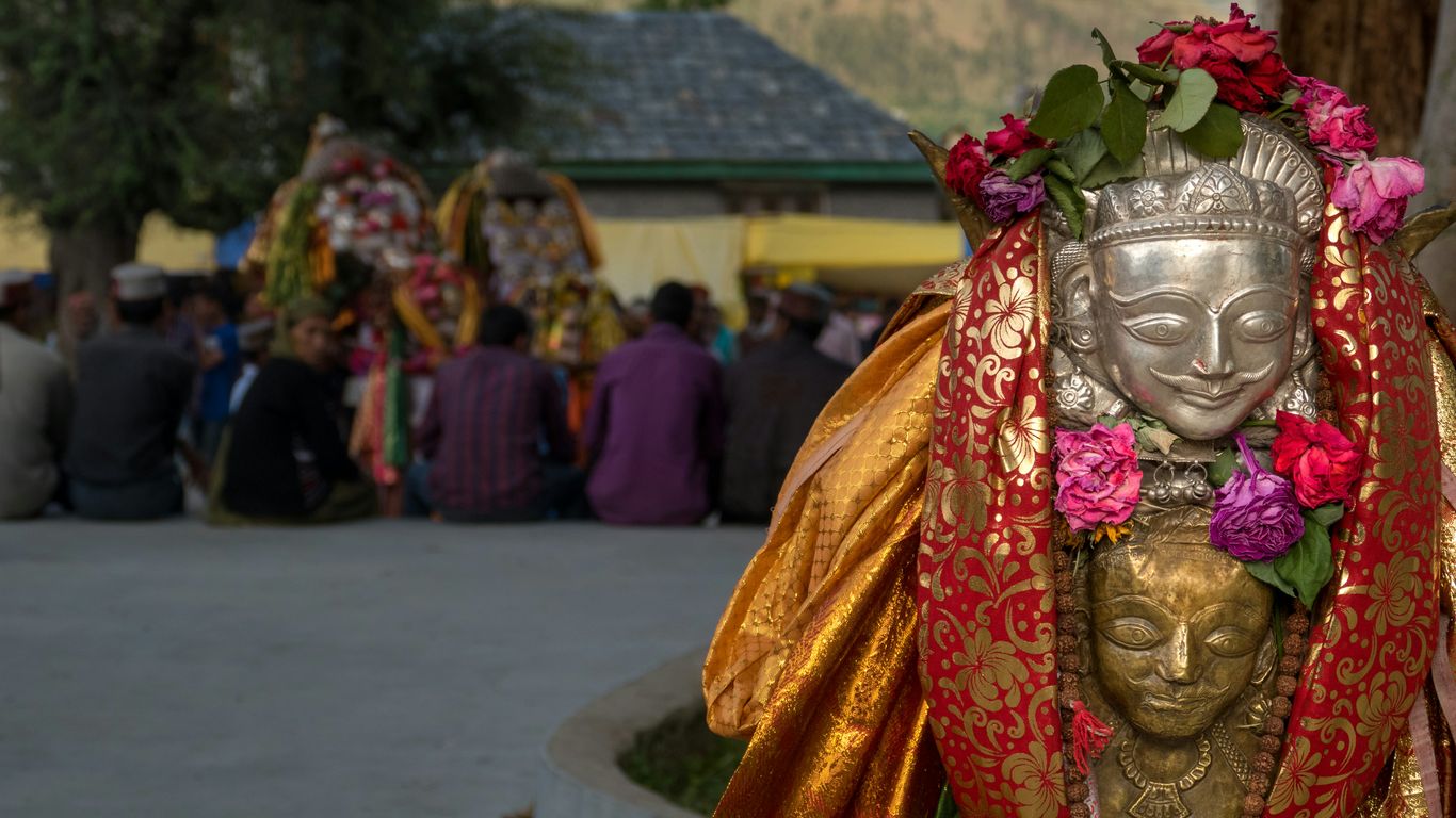 a statue of a person with flowers in their hair