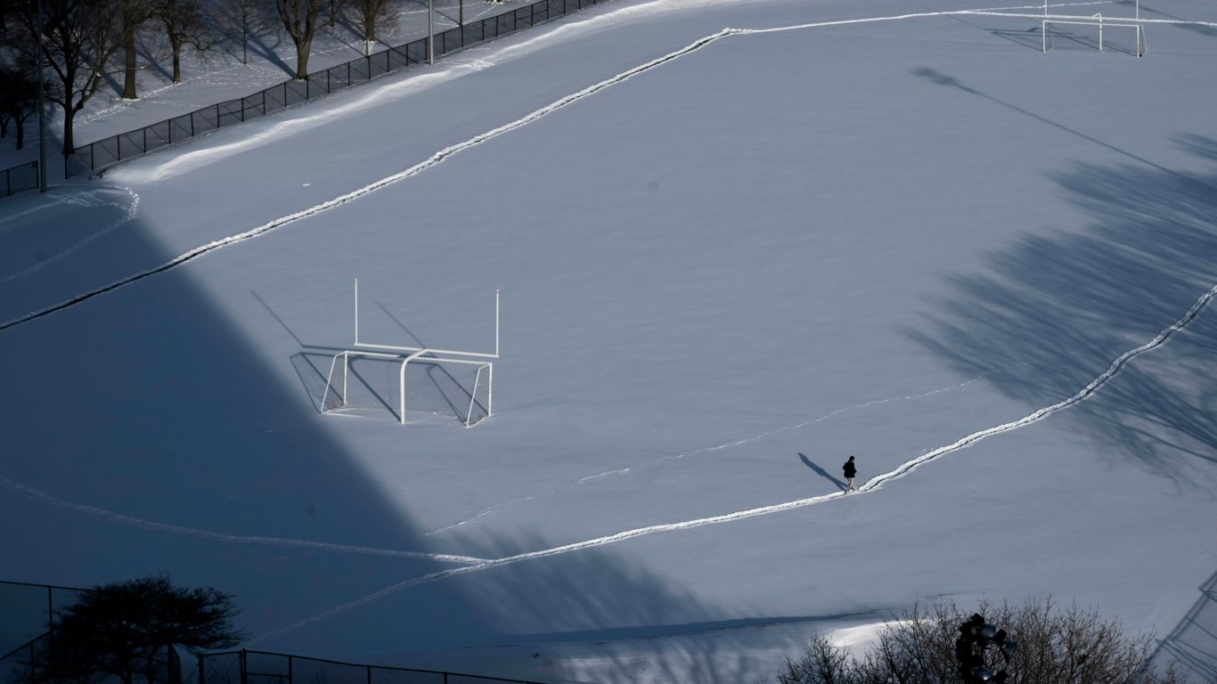 a person riding skis down a snow covered slope