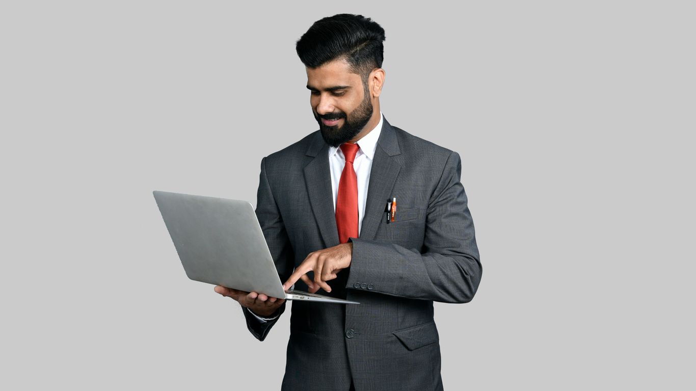 a man holding a laptop