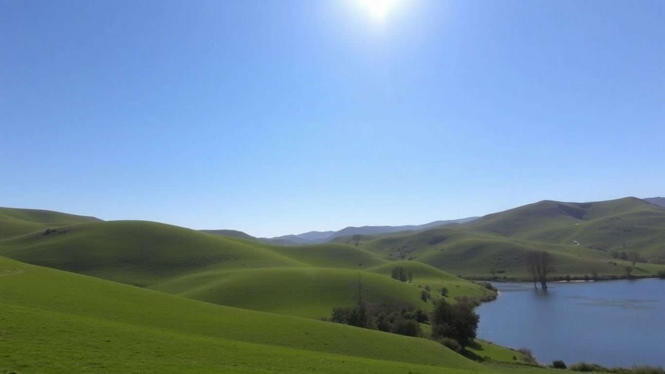Peaceful Victorian landscape with hills and a lake.