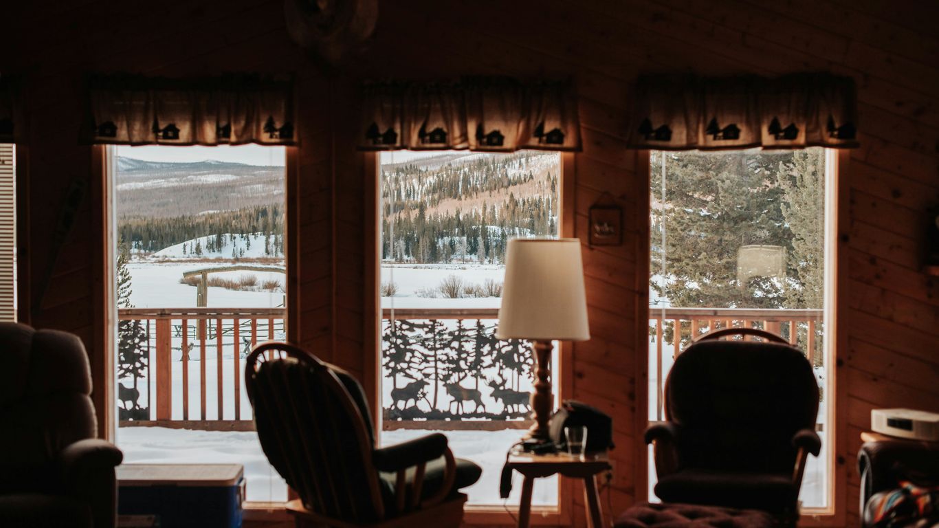 brown wooden chair near window