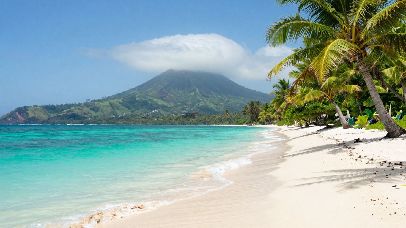 Secluded Bali beach with turquoise water and palm trees.