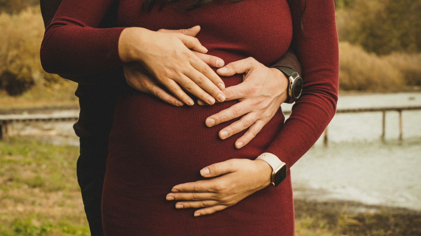 woman in red long sleeve dress