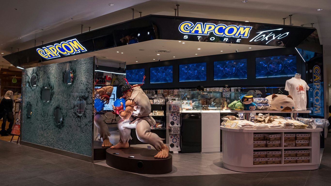 a store with a statue of a man holding a baby