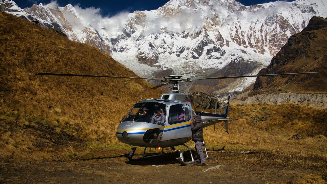 a helicopter that is sitting in the dirt