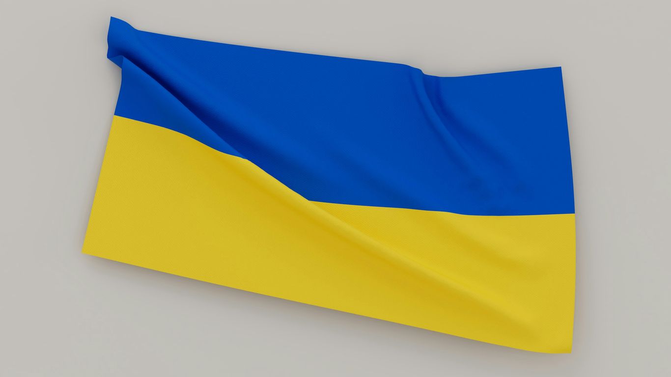 a blue and yellow flag on a gray background