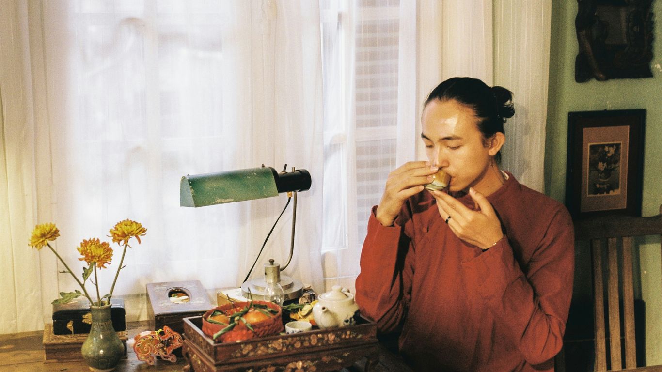 a woman sitting at a table eating food