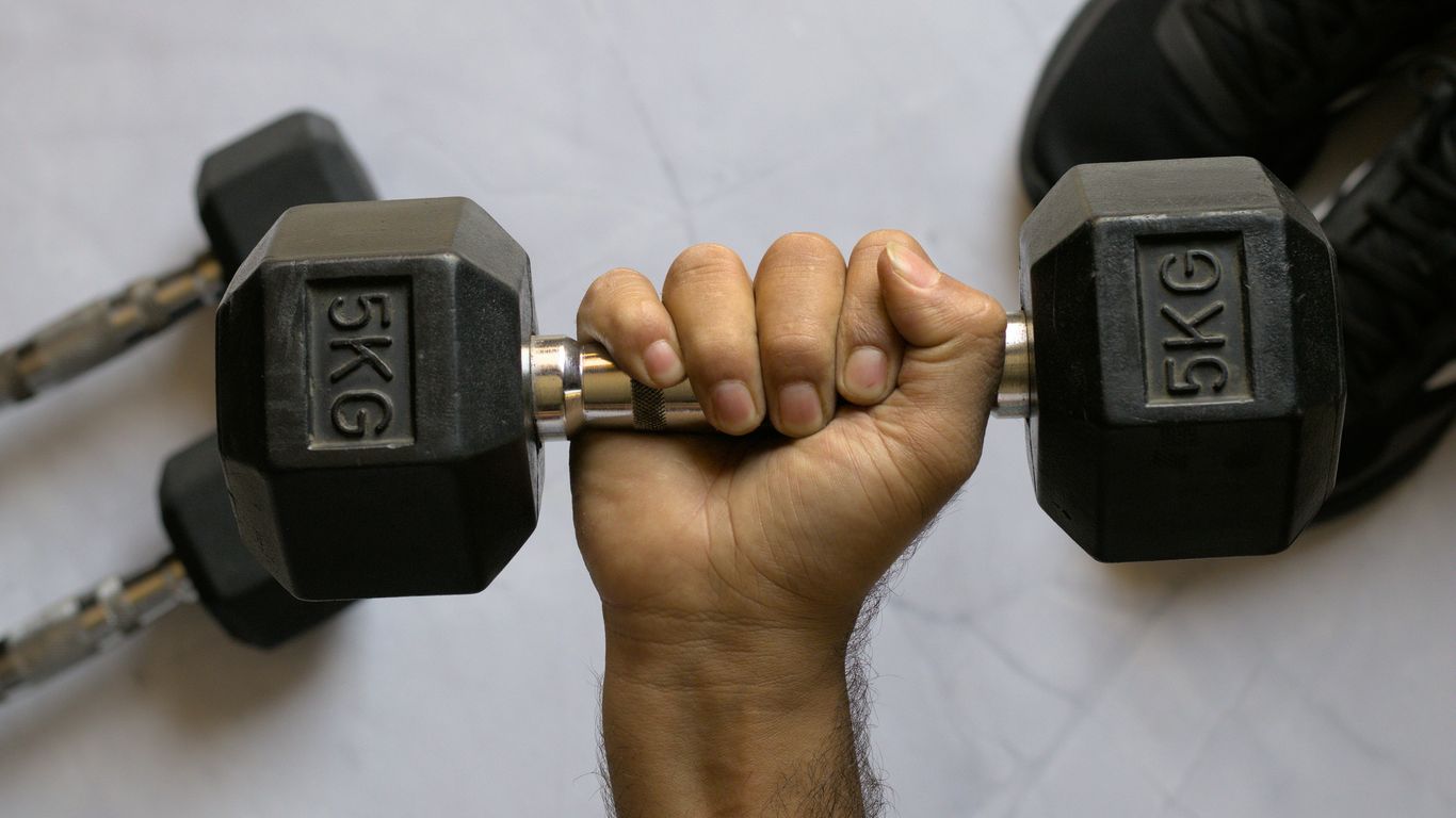 a hand holding a key chain