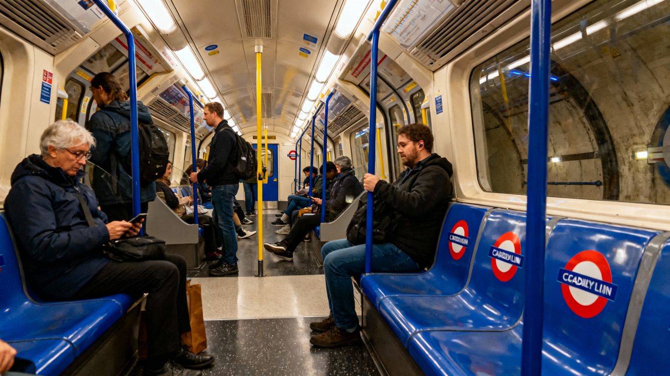 Travelers on London Underground Piccadilly Line train