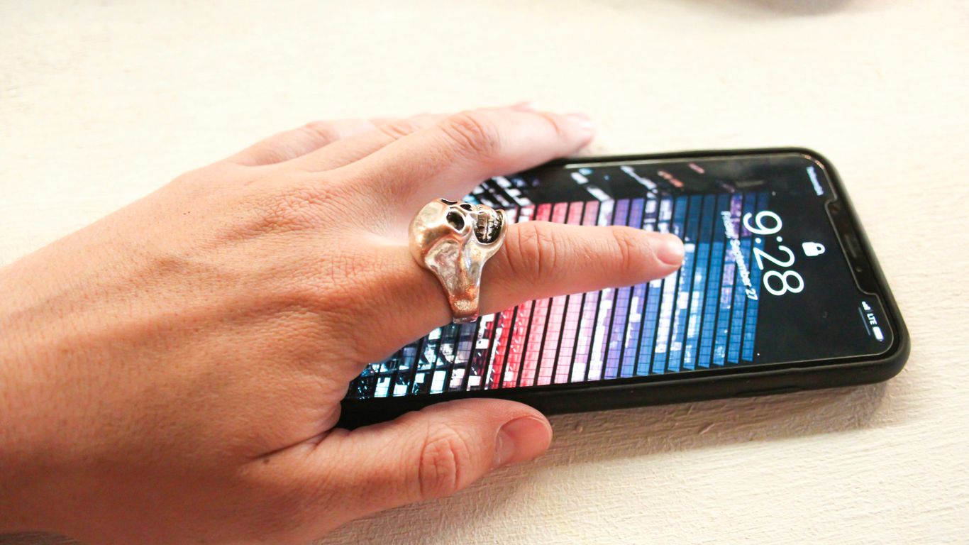 person wearing silver-colored ring