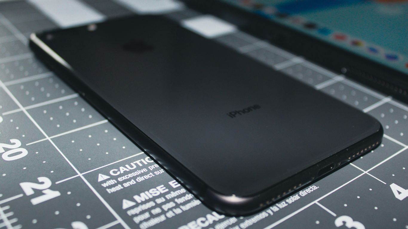 a close up of a cell phone on a table
