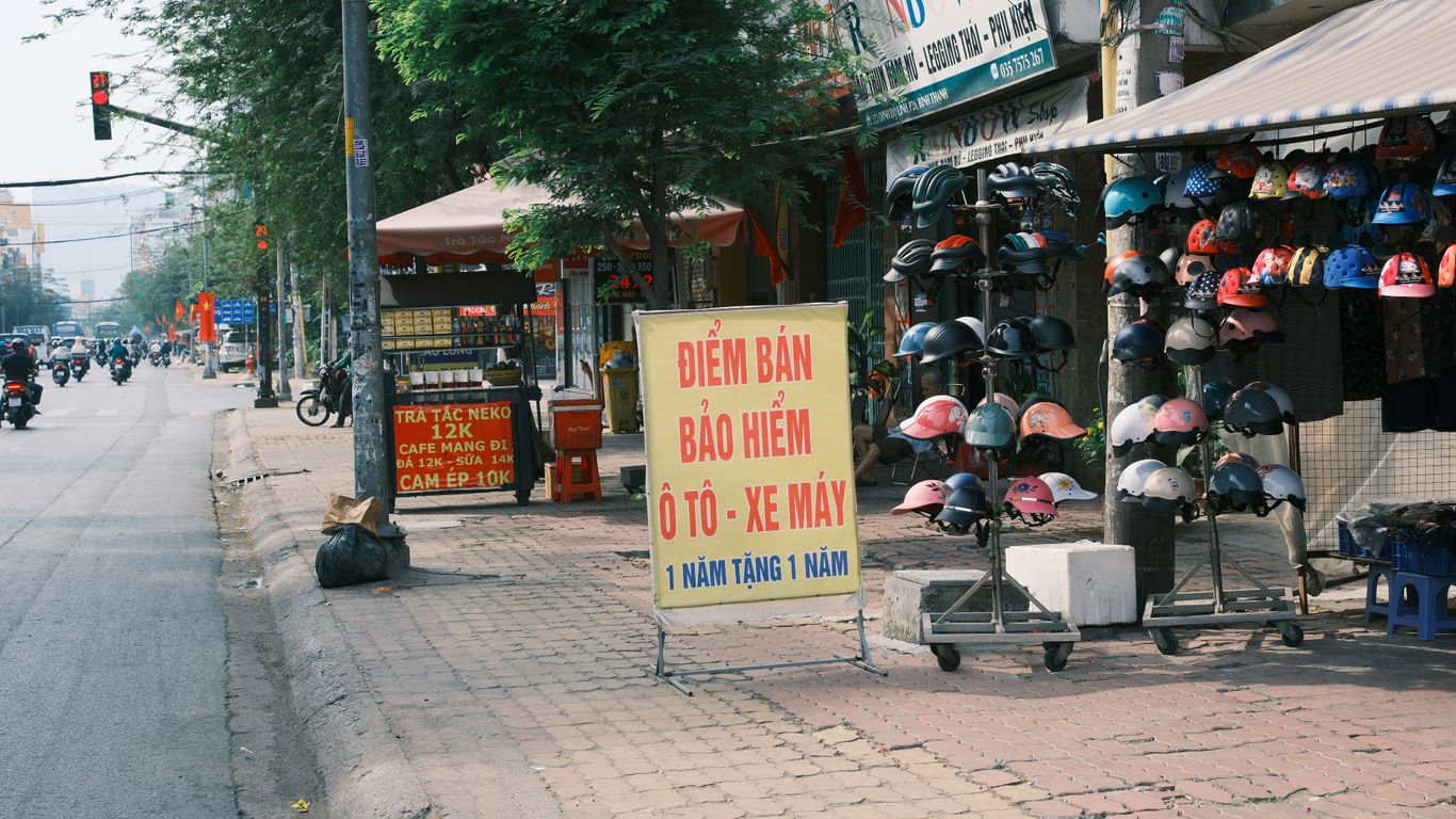A street scene with a store and a motorcycle