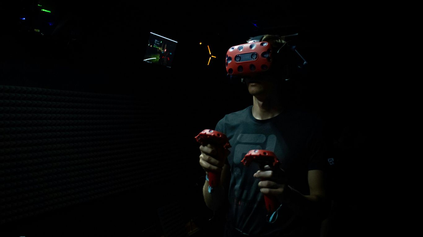man wearing red virtual reality headset