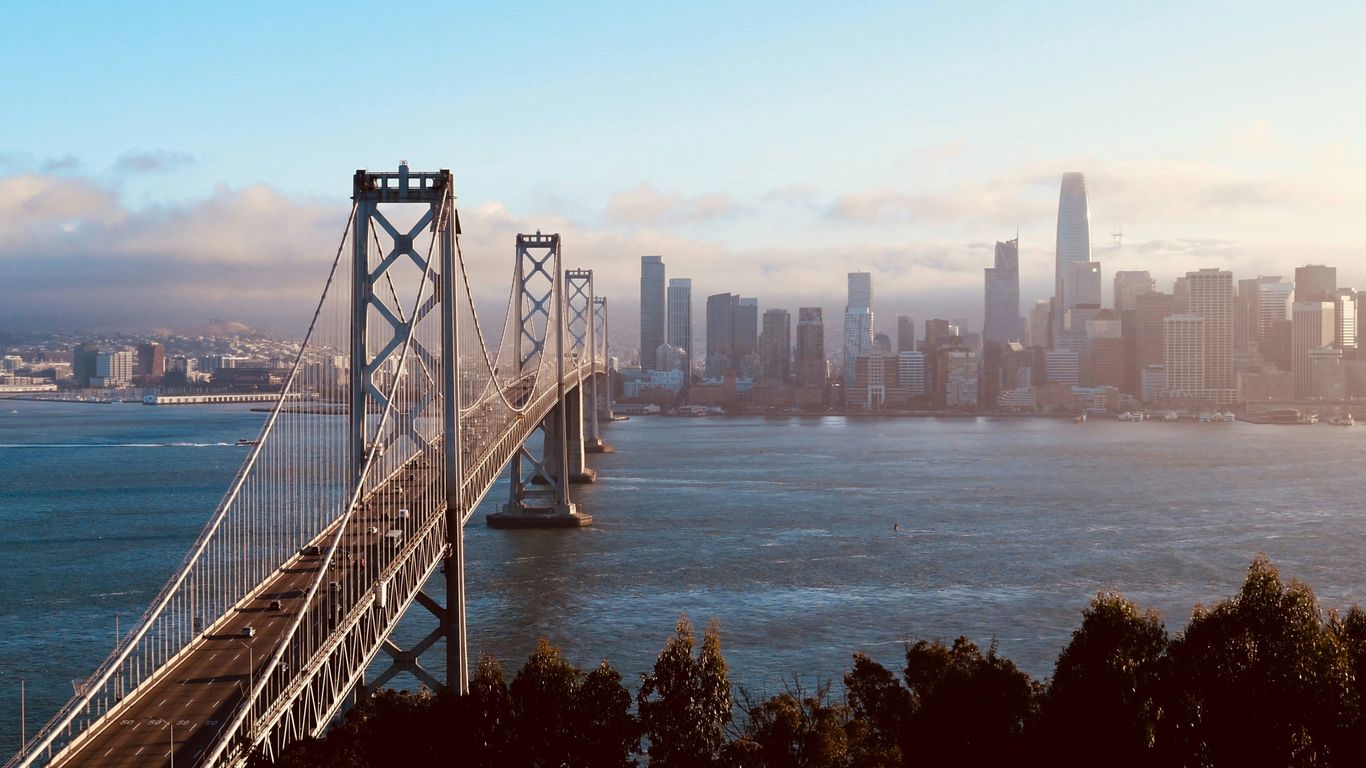 San francisco bay bridge and city skyline at sunset