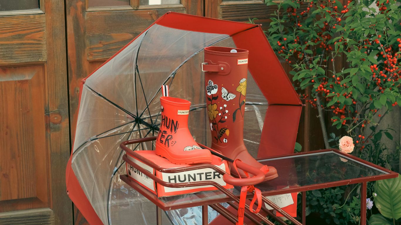 Red boots and umbrella are ready for the rain.