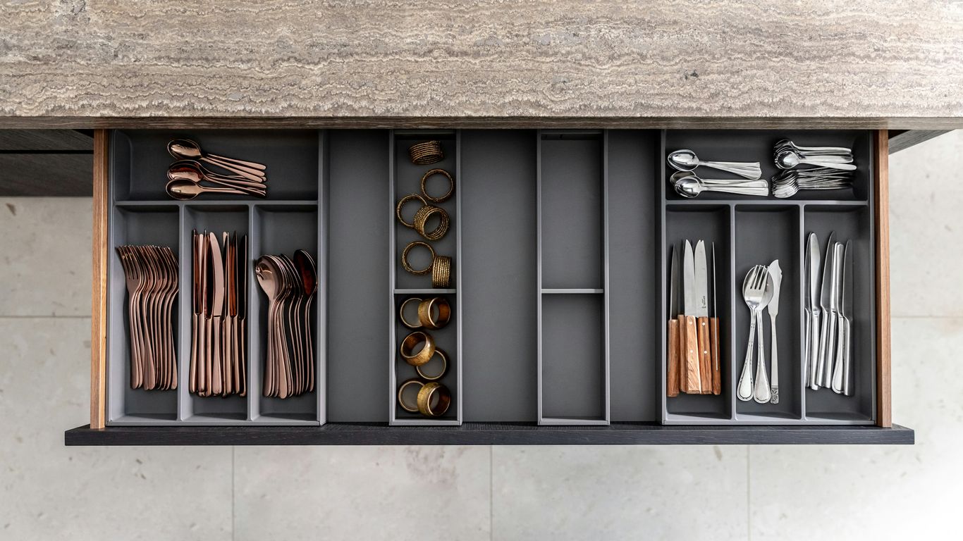 a shelf filled with lots of different types of utensils