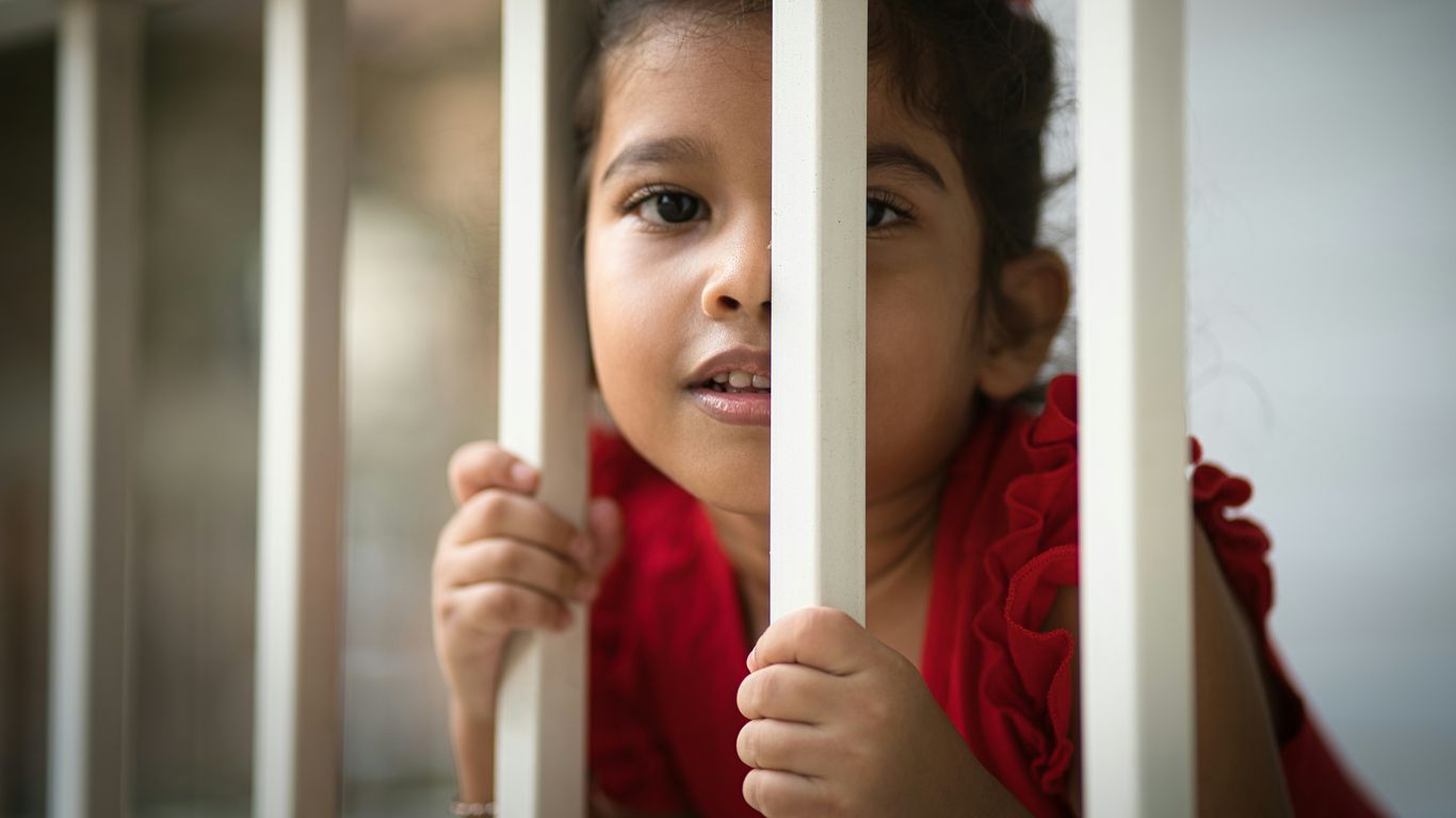 a person holding a white pole