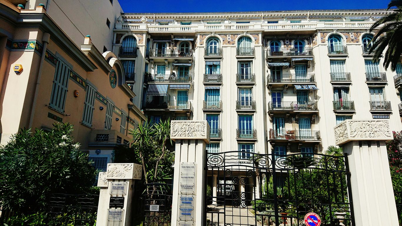 a tall building with a gate in front of it