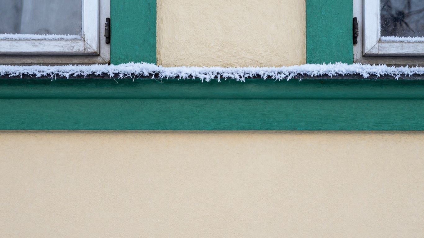 House exterior paint with frost in winter.