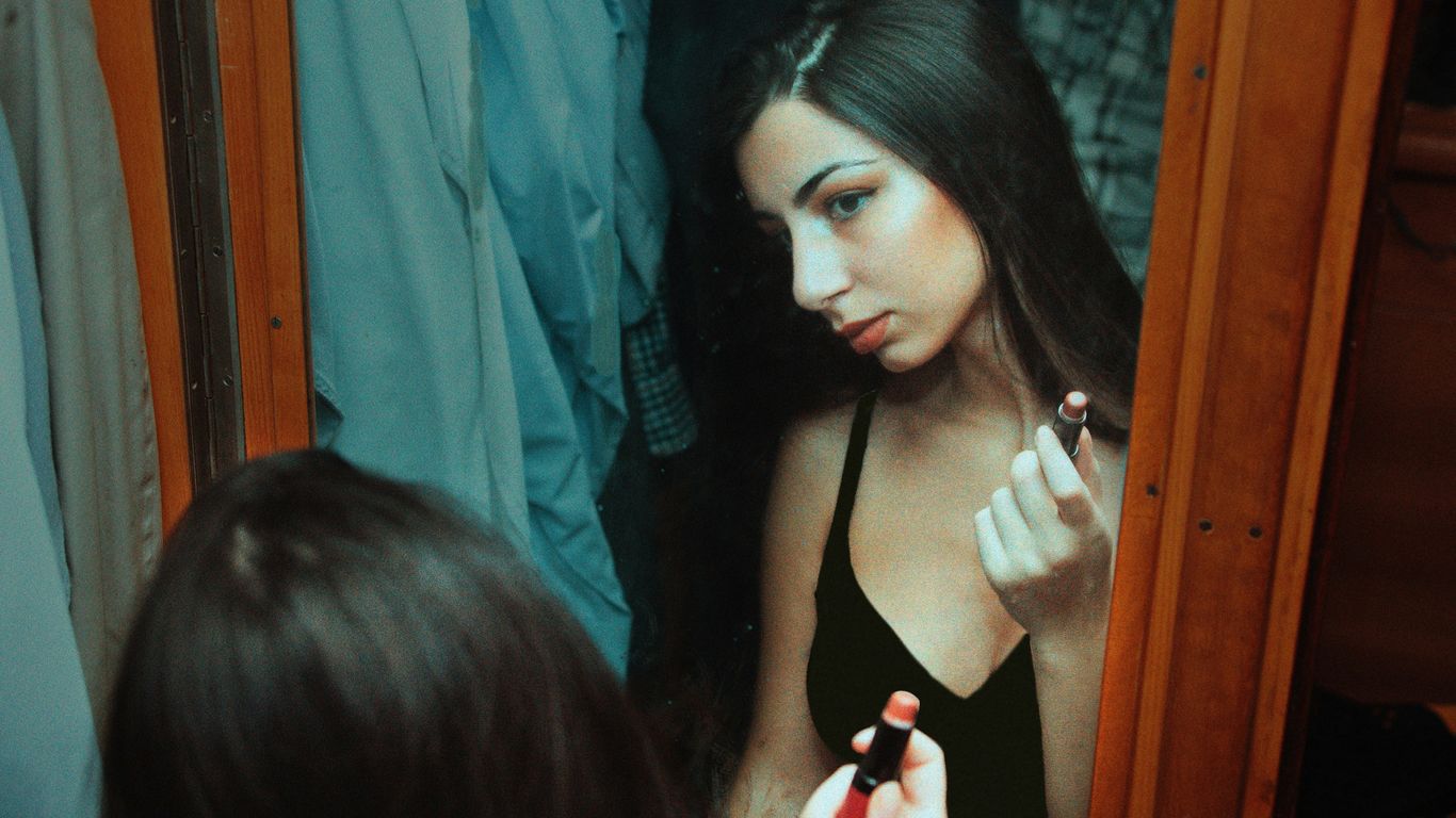 woman in black spaghetti strap top