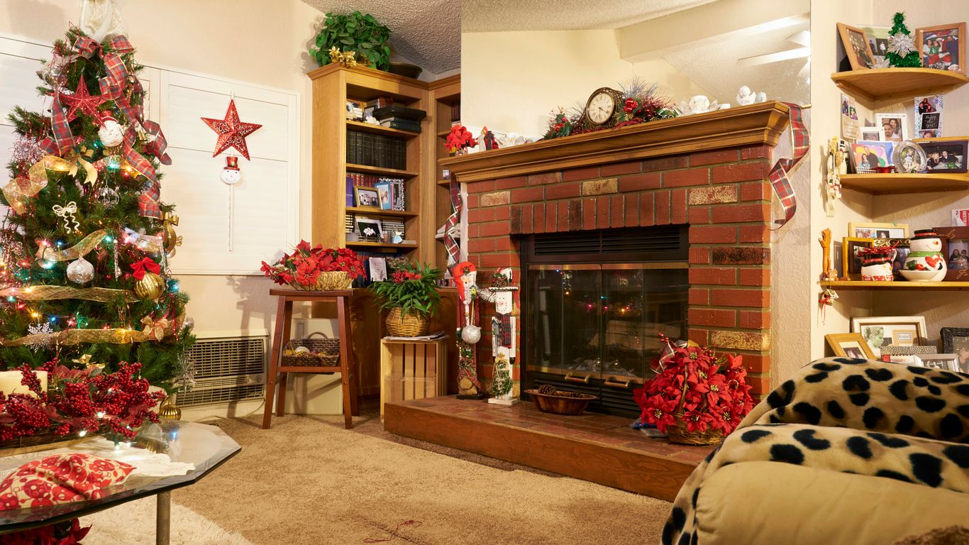 brown wooden fireplace mantle with christmas tree