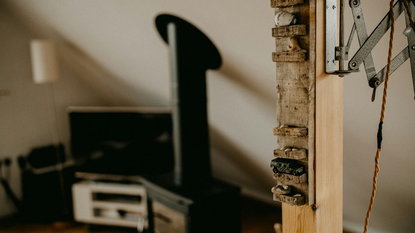A rustic interior with a wood stove and television.