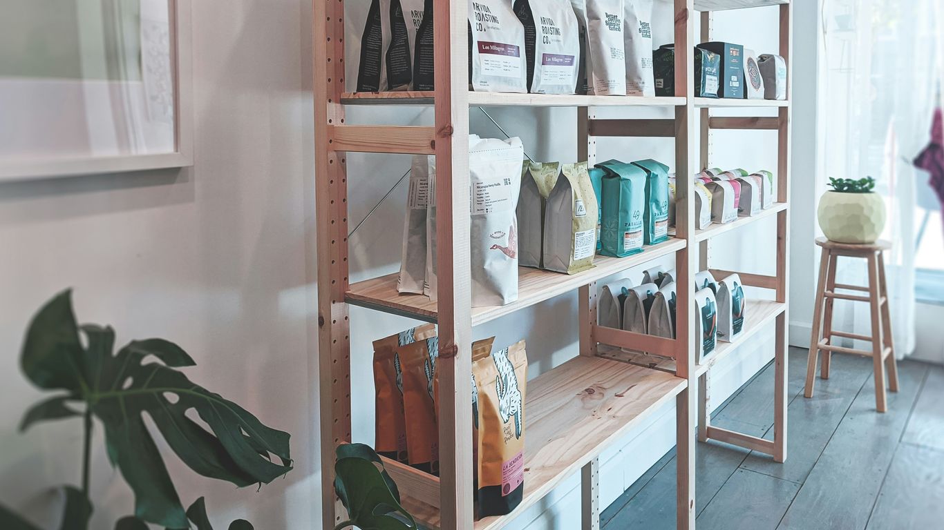 brown wooden shelf with books