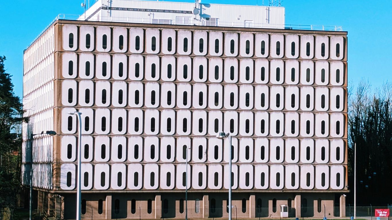 a large building with many windows on the side of it
