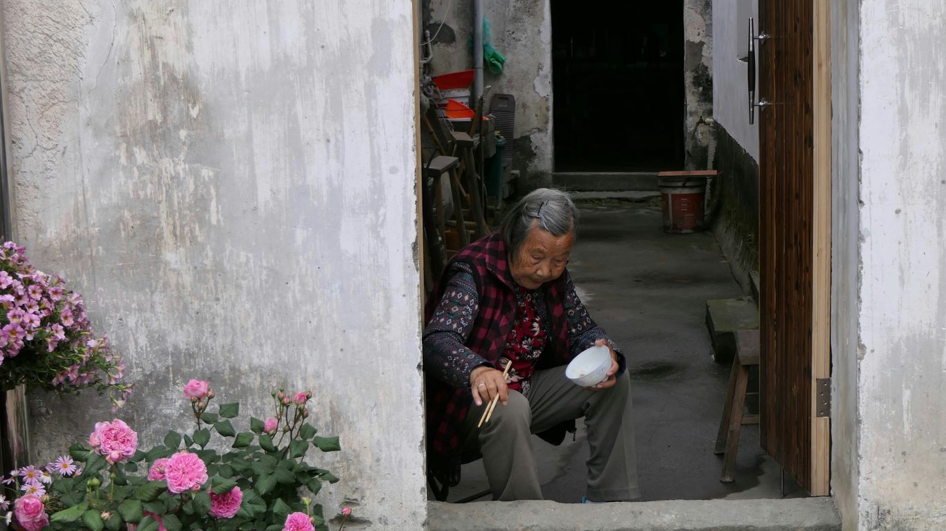 woman holding brown chopsticks